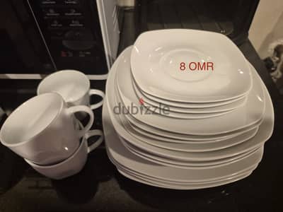 A set of plates with cups