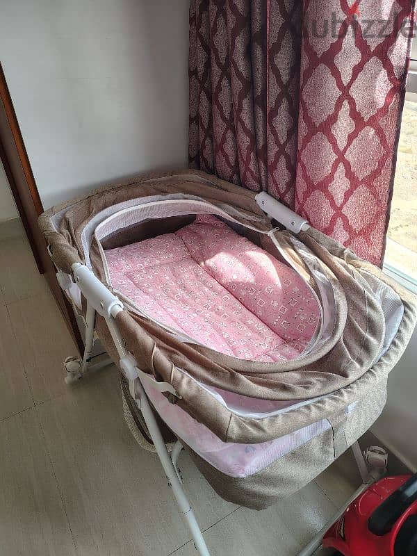 New baby cradle with 2 beds, one new bath tub and one carrying bed 2