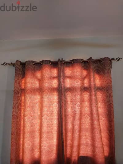 Designer curtain rods with curtains