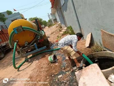 cleaning septic tank and block pipe open