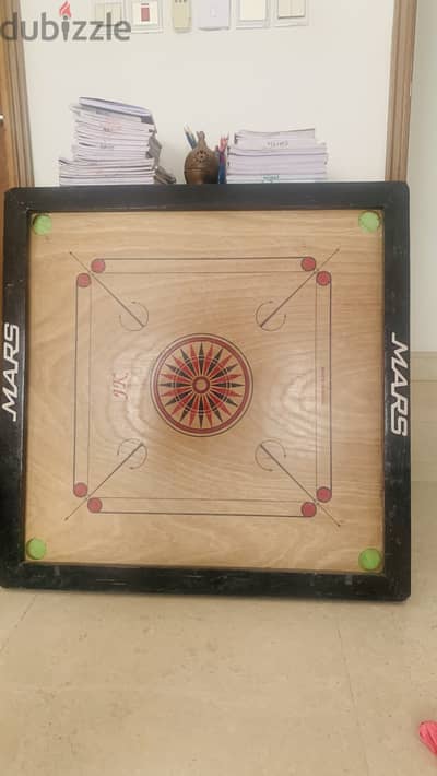 Carrom board with coins & striker