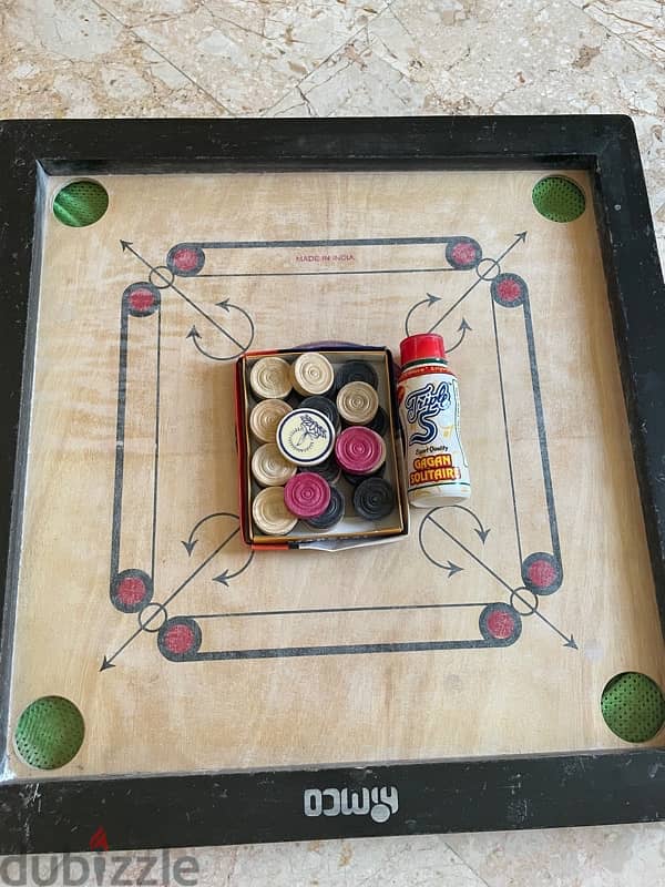 carrom  board with coins and powder 1