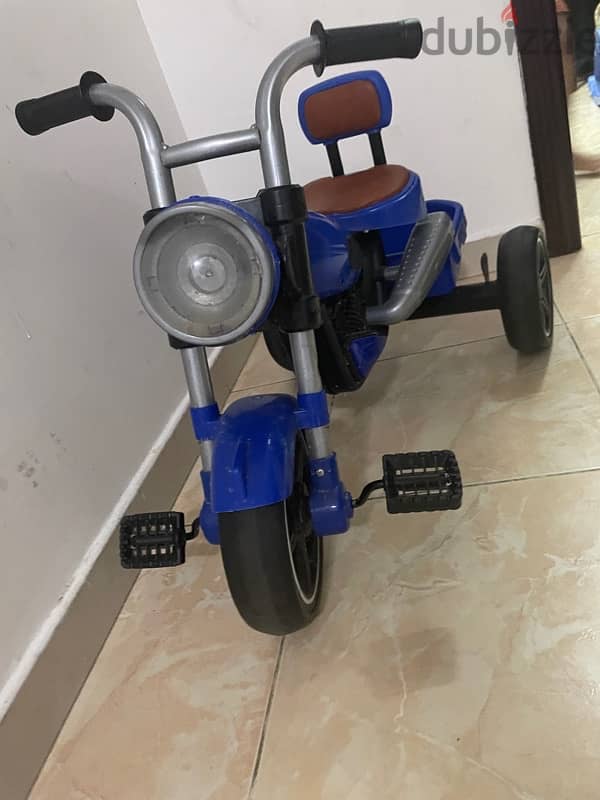 kids tricycle and tollo car good condition 1