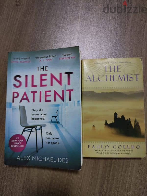 two books for sale- The silent patient- The alchemist 0