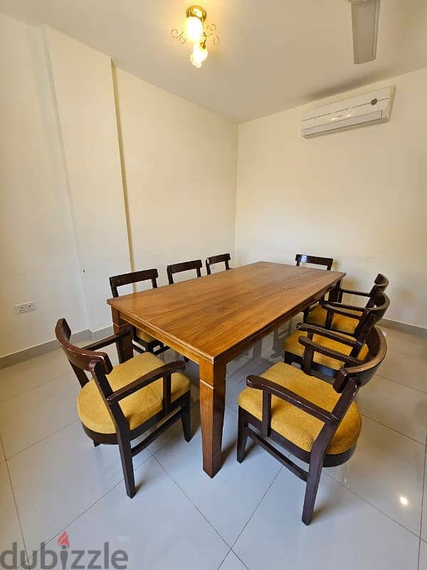 8 seater wooden table & chairs 1