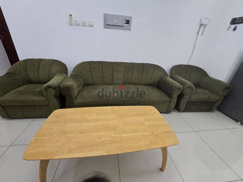 Sofa and heavy wooden center table to sell 0