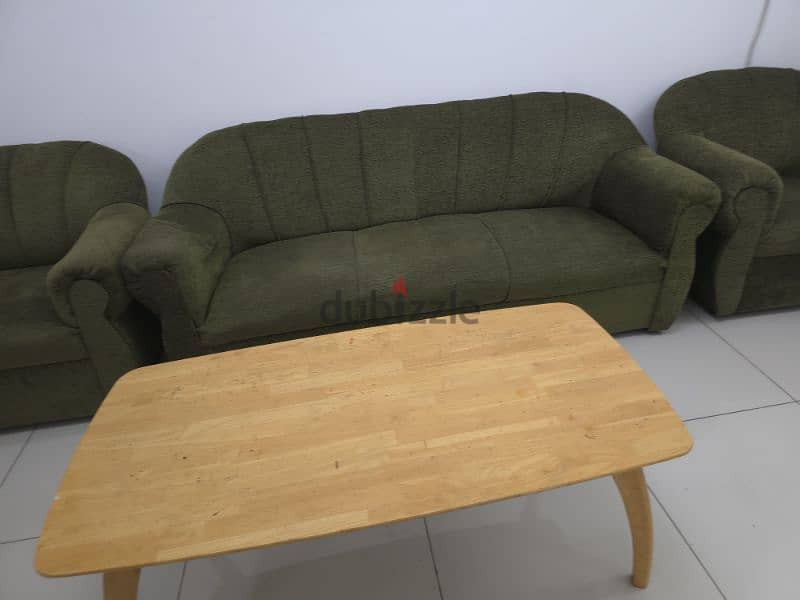 Sofa and heavy wooden center table to sell 1