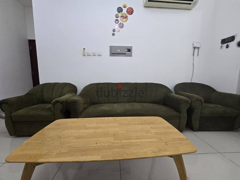 Sofa and heavy wooden center table to sell 2