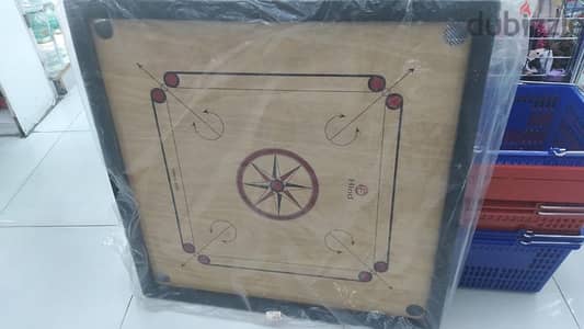 carrom board and striker