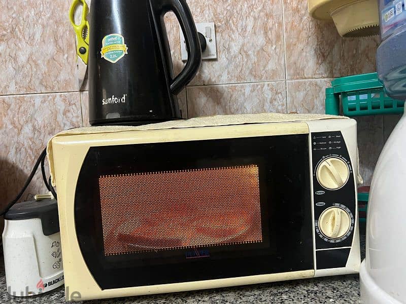 Microwave  RO 10/- and Convection oven with wheel stand RO 25/- 2