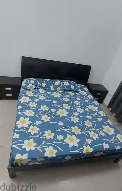 Double bed with mattress and two side tabless