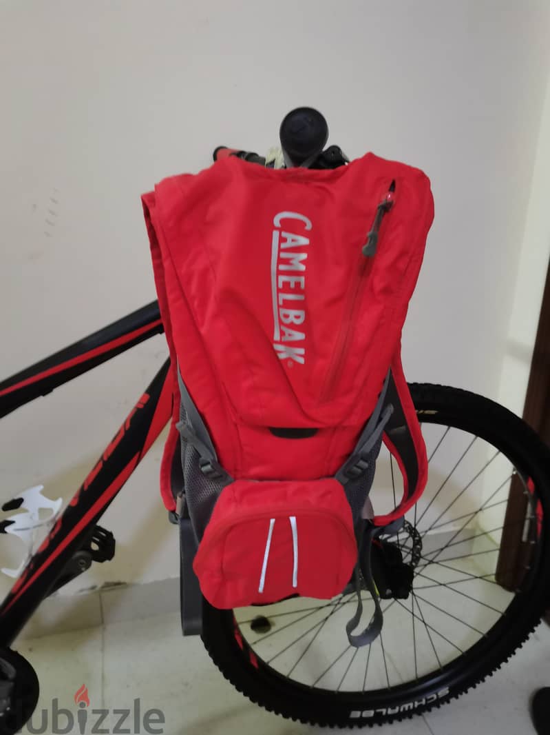 Mountain bike + free helmet and camelbak 3