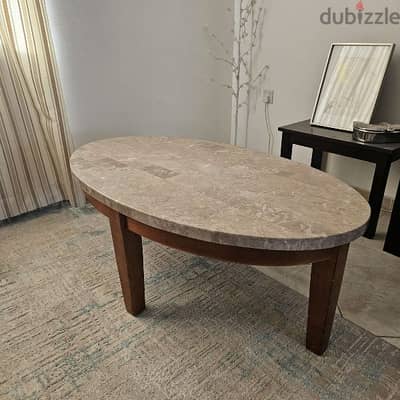 Marble table with wooden legs