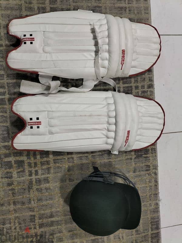 cricket pad and helmet 0