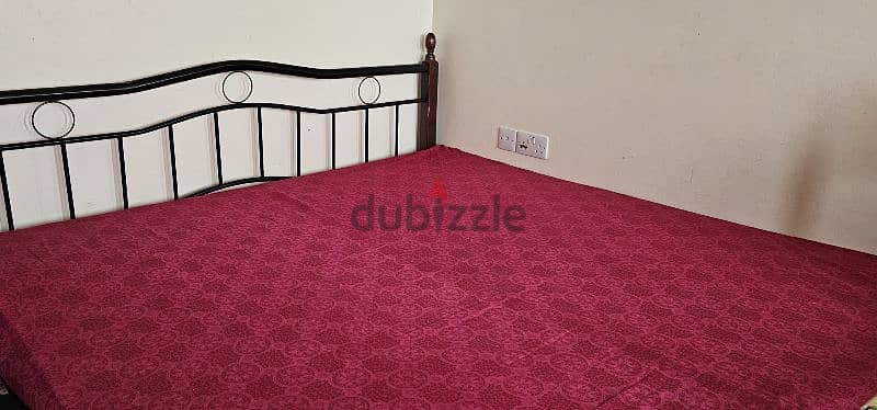 king size iron bed, Large red table, 3 plastic chair, Wooden table 2