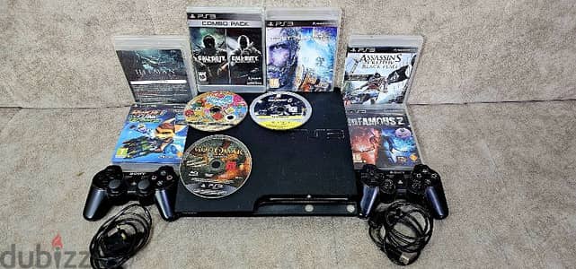 PS3 WITH CONTROLLER AND 17 GAMES