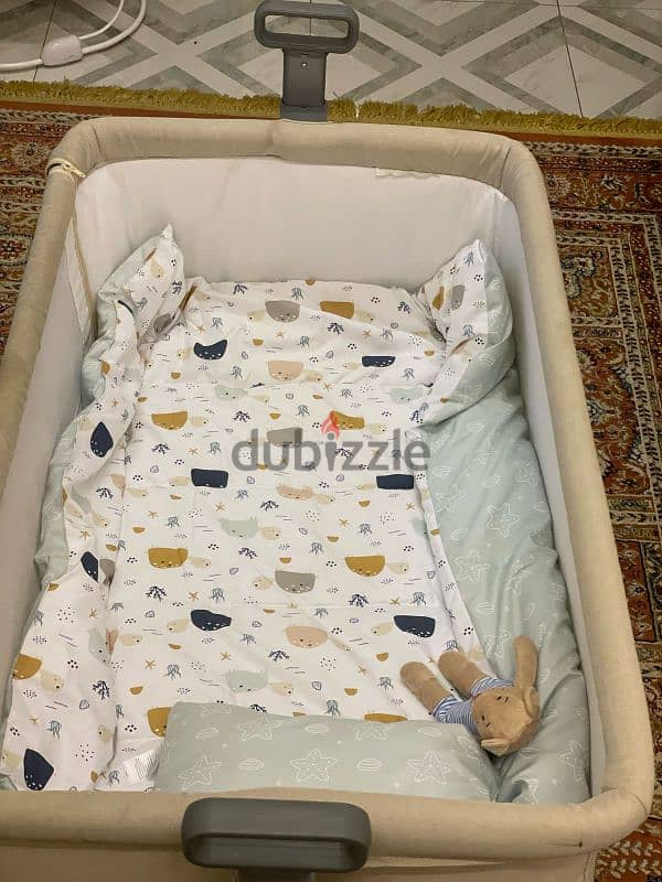 OMR 30 : 2 items : Center Point Juniors Bassinet And Juniors  Bounce 2