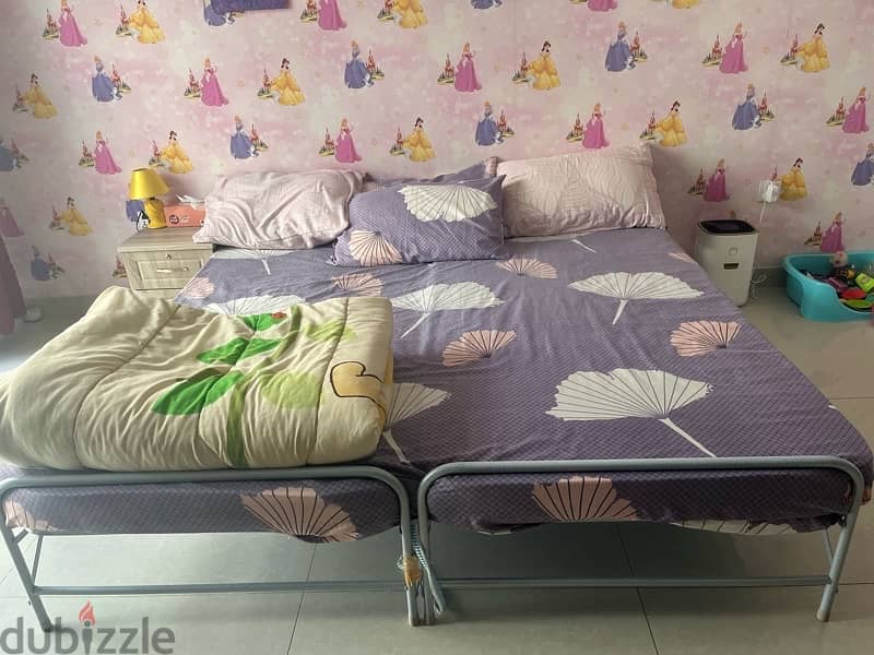 two single foldable beds 1