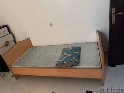 wooden bed and mattress