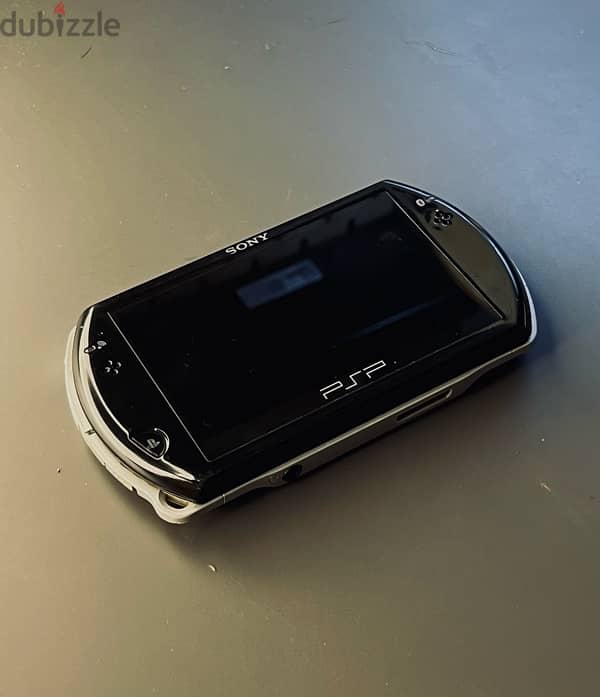 PSP Go Perfect condition 32 gb of games 4