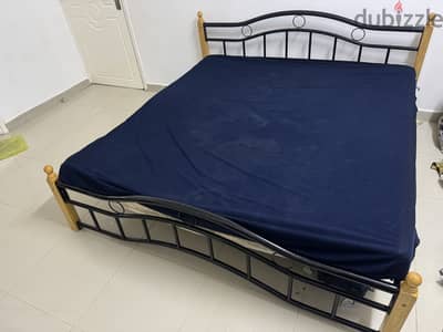 Used metal king size bed without mattress