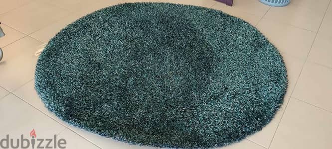 round ml blueish carpet