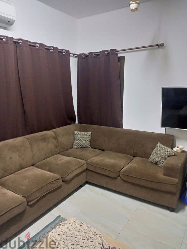 L Shape sofa with black out curtains and rod 1