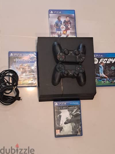 Play Station 4 1TB hard drive with 4 games and 2 controllers