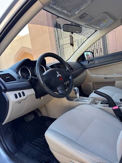 Mitsubishi Lancer 2014  Oman lady used very clean car