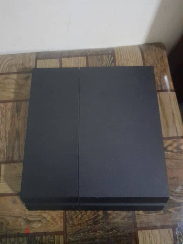 1tb playstation with one controller and 4 games and a stand 7