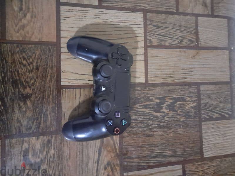 1tb playstation with one controller and 4 games and a stand 10