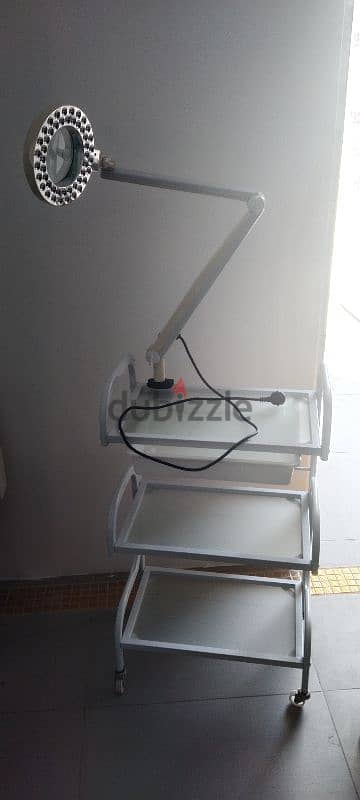 metal and glass table with spot light