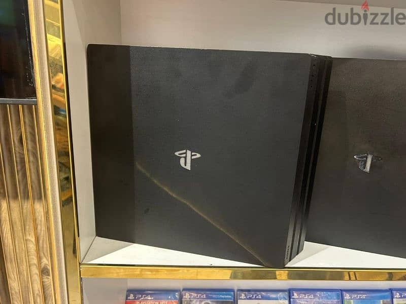 Playstation 4 Pro with 2 controllers 1 TB interested 79784802 3