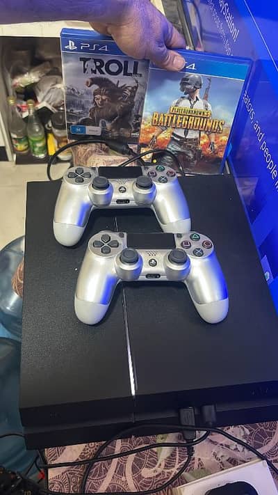 Playstation 4 with 2 controllers and games   79784802