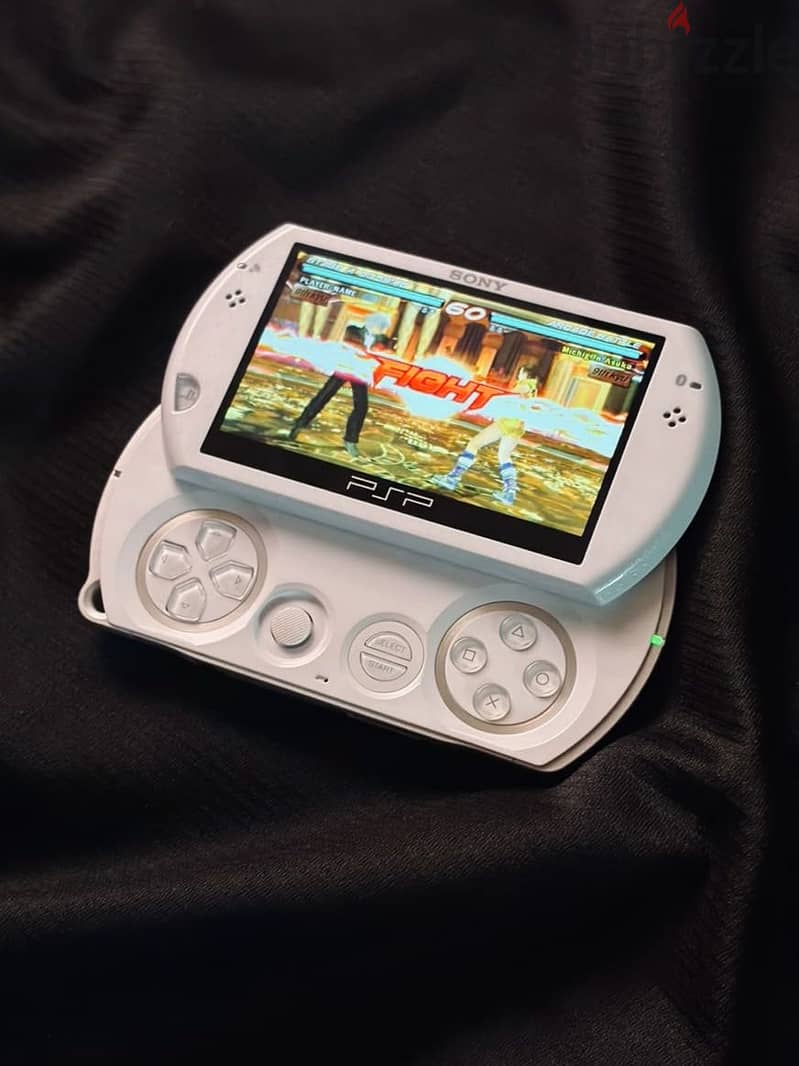 PSP go-play station portal go. included with original charger 1