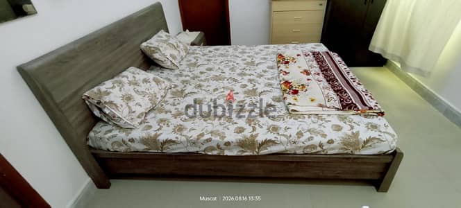 king size bed with side tables and mattress