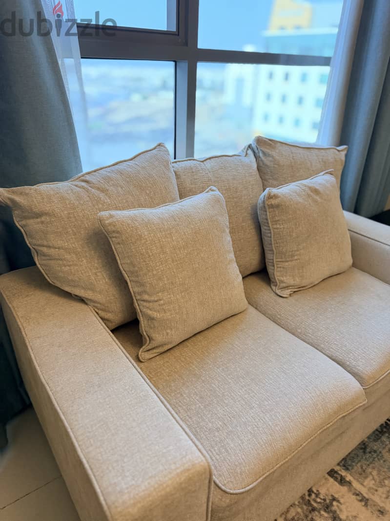 3 seater comfy beige sofa 5