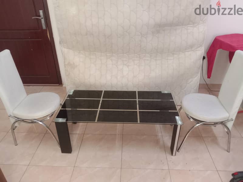 Glass table and two chairs good condition all only 19 Riyal 1
