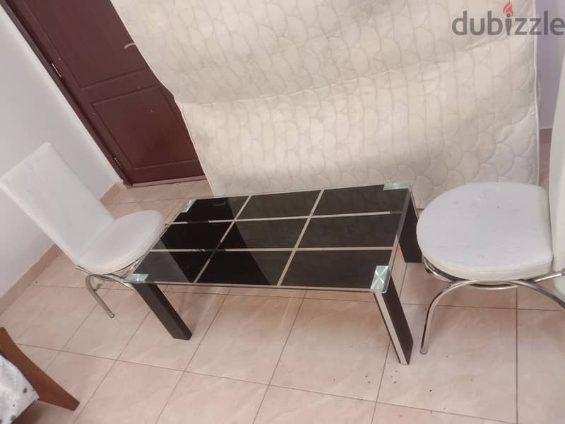 Glass table and two chairs good condition all only 19 Riyal 4