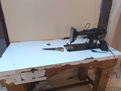 sewing machine with table, motor and scissor
