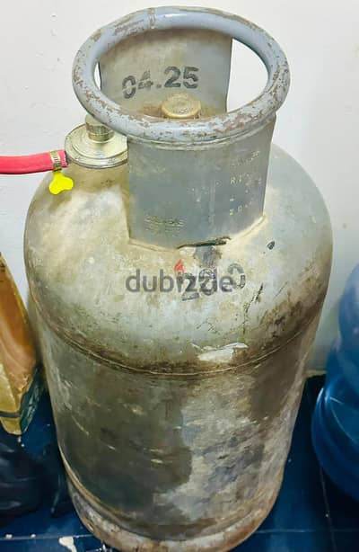Gas cylinder, Gas stove, small chair and table