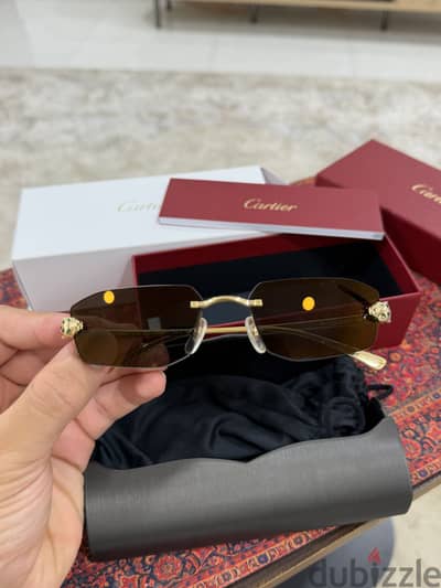Cartier CT0474S Sunglasses – Gold Rimless Design