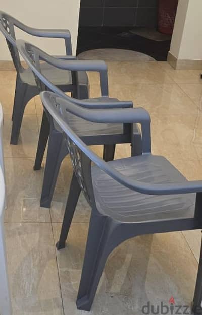 Plastic chair with hand rest