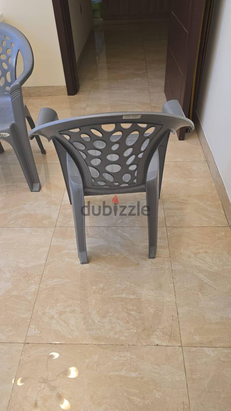 Plastic chair with hand rest 2