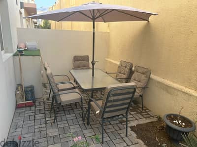 Table set with umbrella and 6 chairs