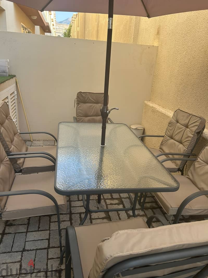 Table set with umbrella and 6 chairs 1