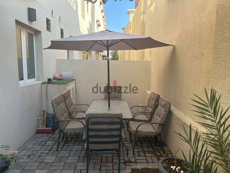 Table set with umbrella and 6 chairs 6