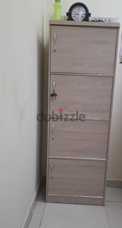long shelf with 4 cabinet with keys
