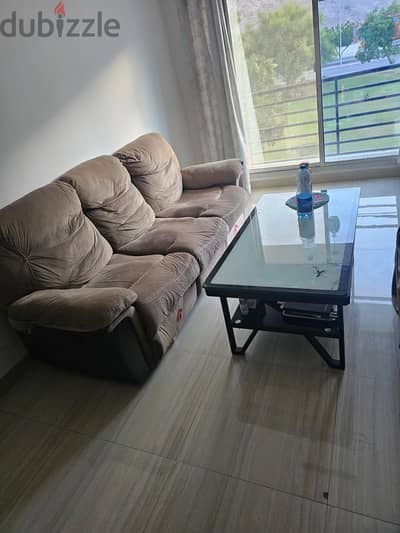 3 seater 2 reclinr sofa & glass central Table for sale urgently