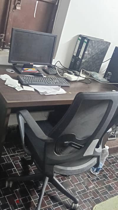 office table with revolving chair and two other chairs